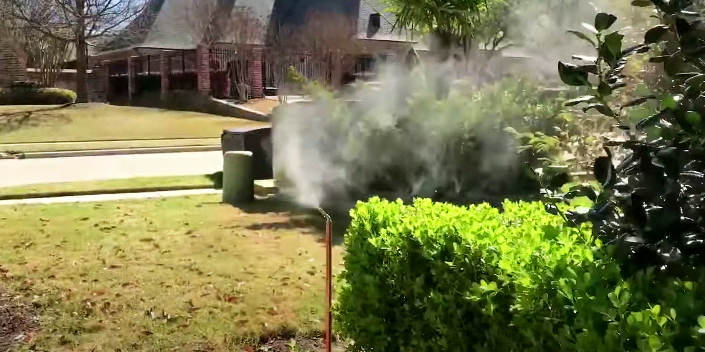 An up-close photo of a mosquito misting system | Source: YouTube/@texanmosquitosystems4178