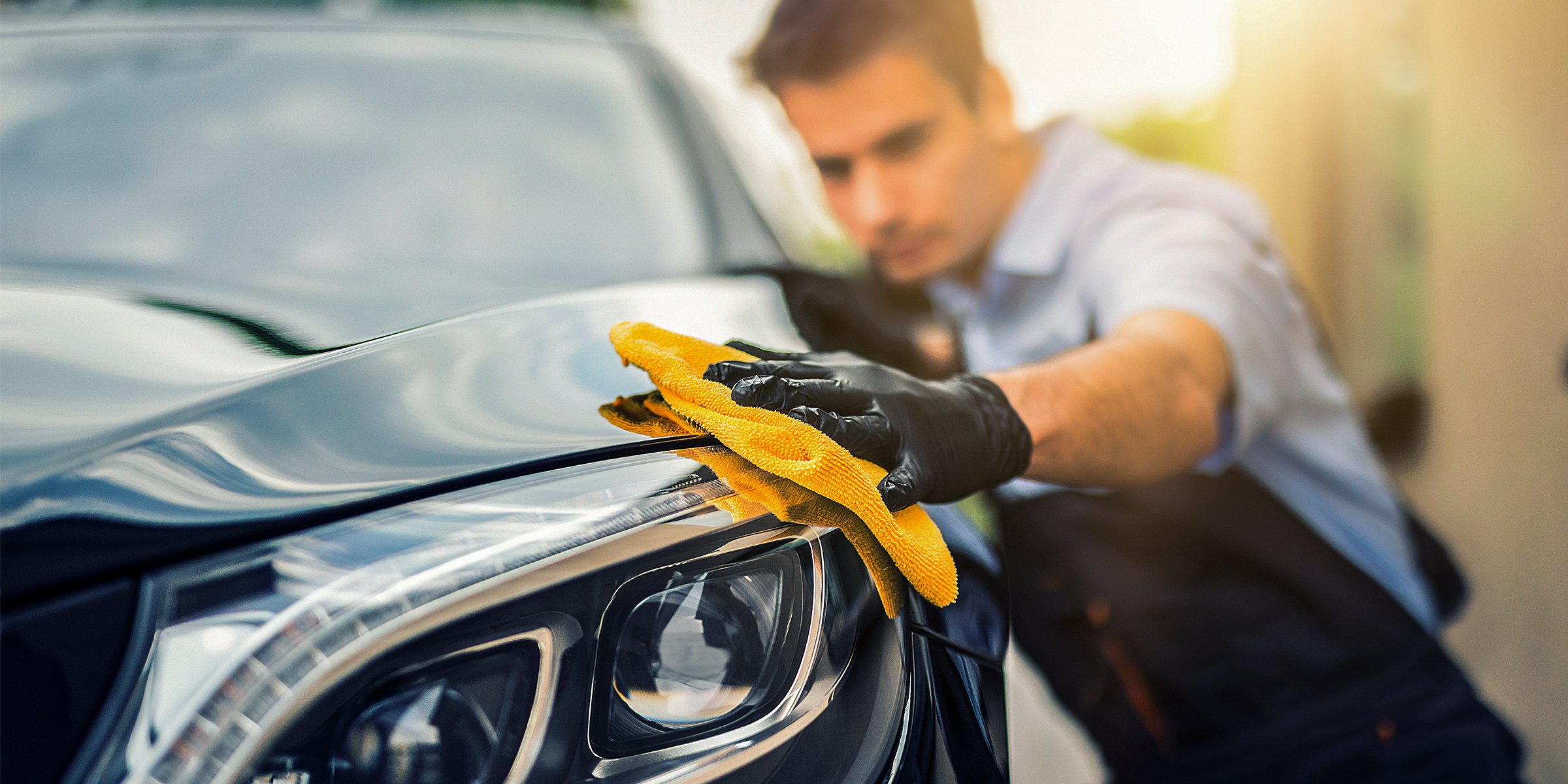 A man polishing a car | Source: Shutterstock