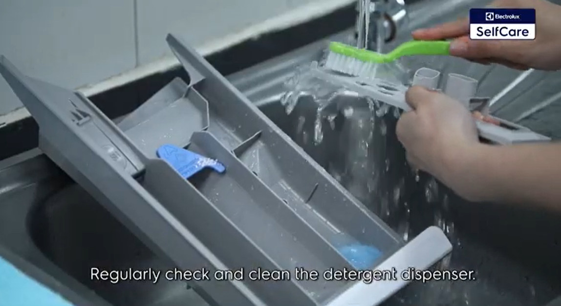 Clean your detergent dispenser. | Source: YouTube/Electrolux Philippines