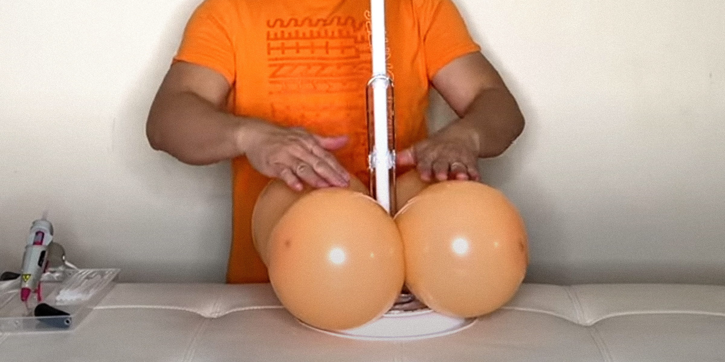 A person crafting a DIY balloon column stand | Source: YouTube/fambamny/videos