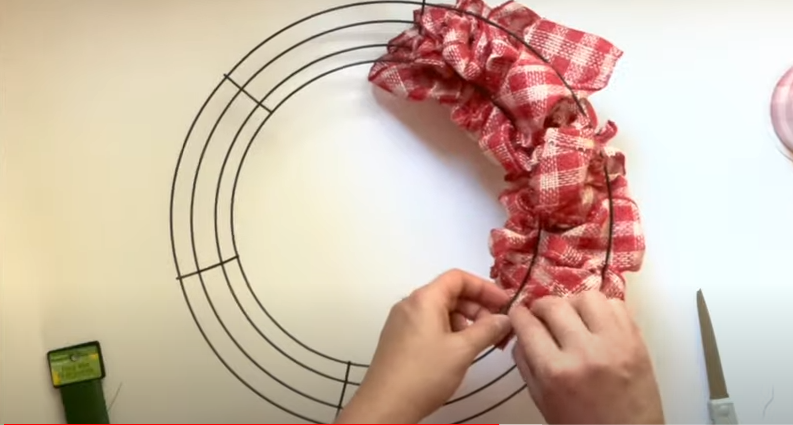 Use a floral wire to secure the ribbon | Source: YouTube/@AWellPurposedWoman