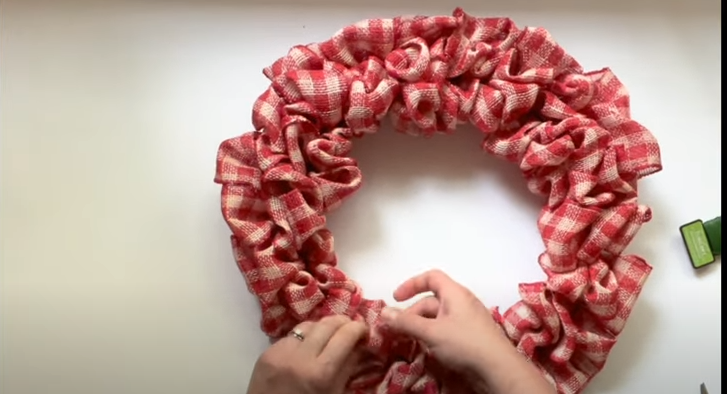 When you repeat the same process, your DIY bibbon wreath will turn out like this image | Source: YouTube/@AWellPurposedWoman