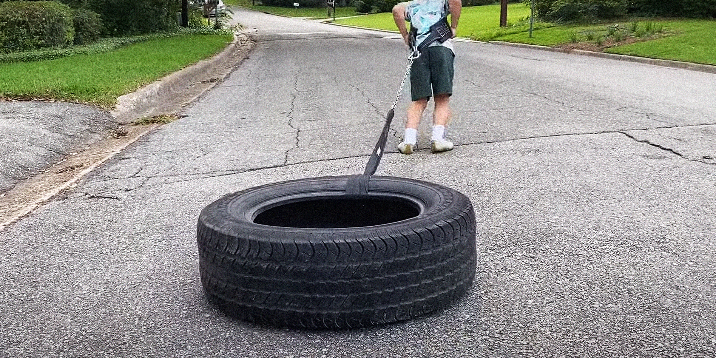 A person training with a tire sled | Source: YouTube/MaddenScience