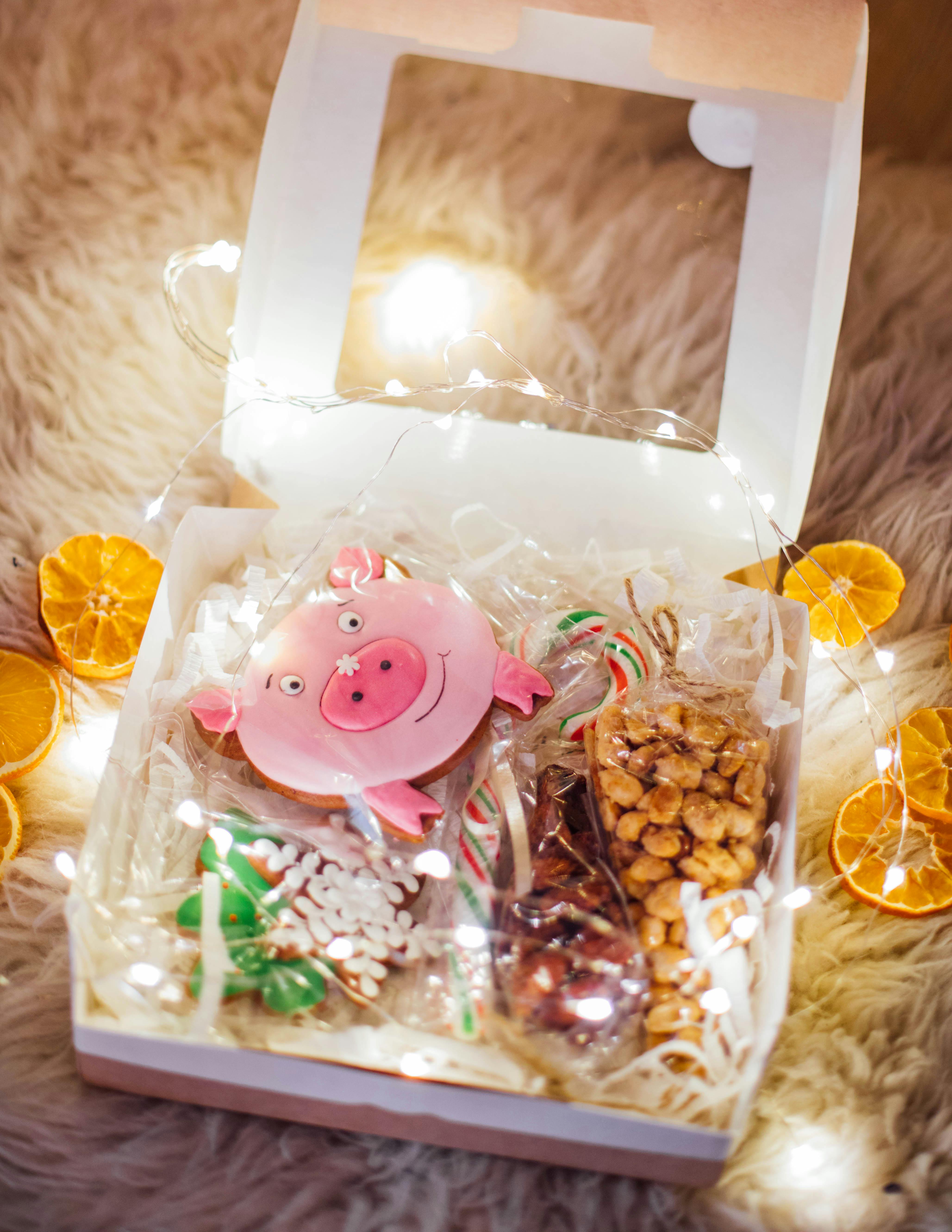 Assorted cookies in a box with a transparent cover in the middle. | Source: Pexels