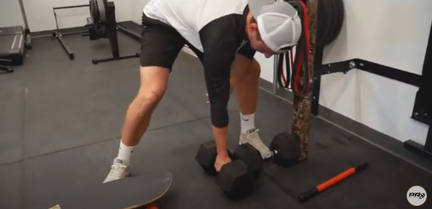 A person holding dumbbells' | Source: YouTube/@prxperformance