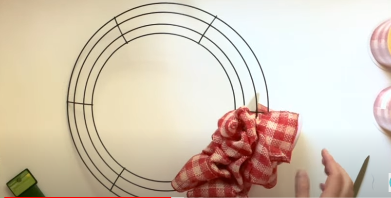 An incomplete DIY ribbon wreath | Source: YouTube/@AWellPurposedWoman