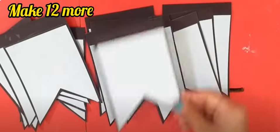 Several papers of incomplete DIY birthday banner | Source: YouTube/@hinalscreation1310