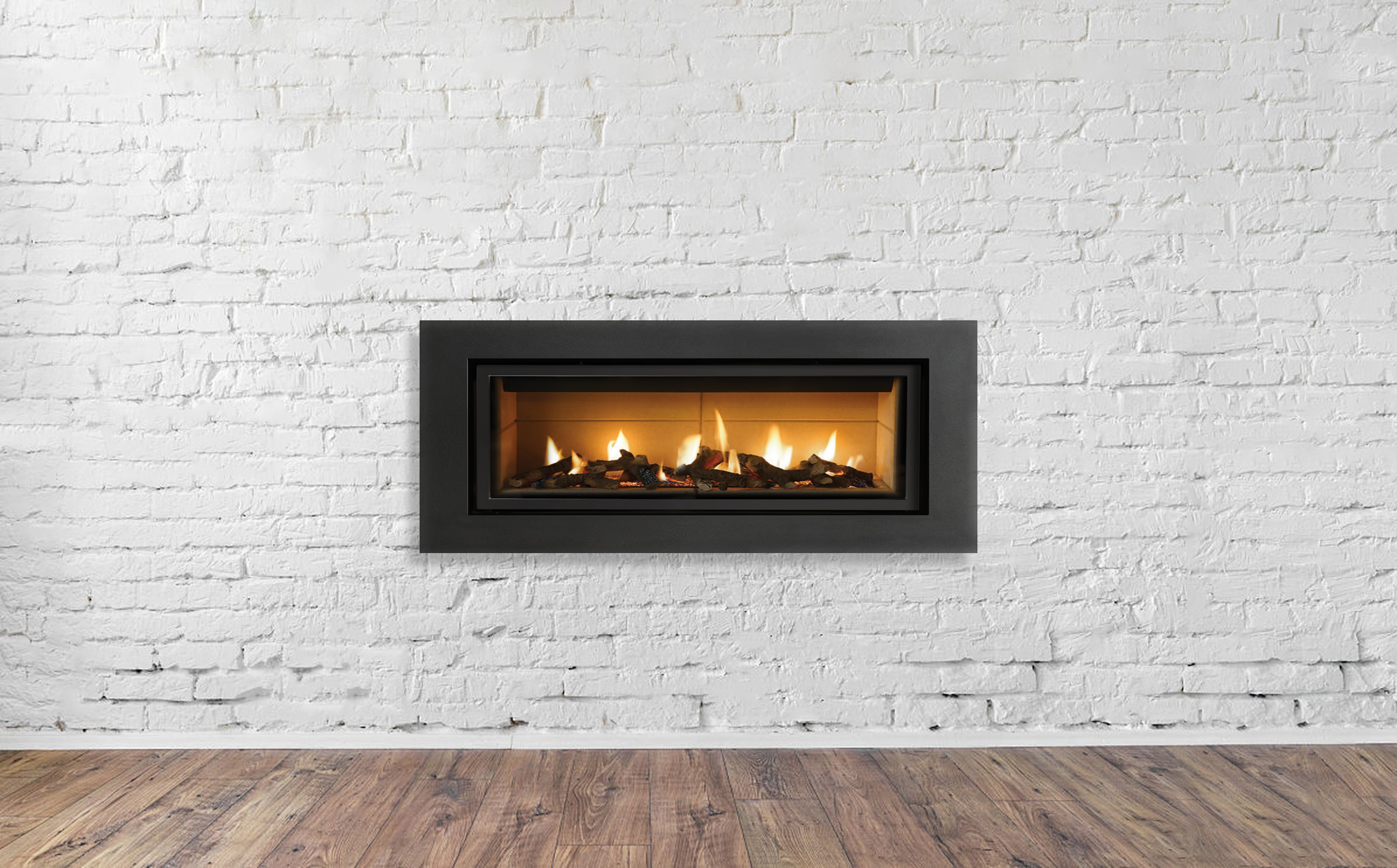 A gas fireplace on a white brick wall | Source: Shutterstock