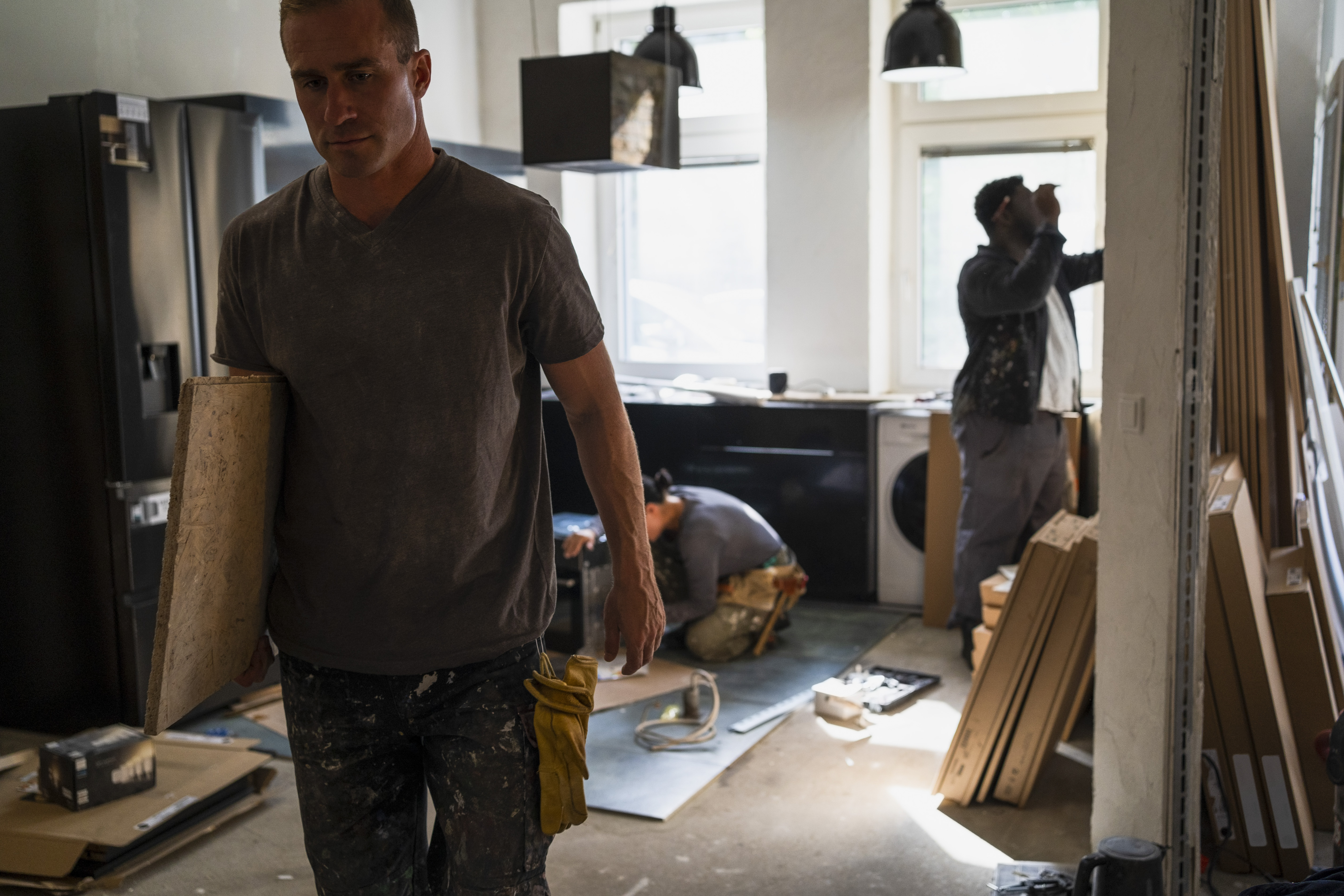 Professionals remodeling a condo kitchen | Source: Getty Images