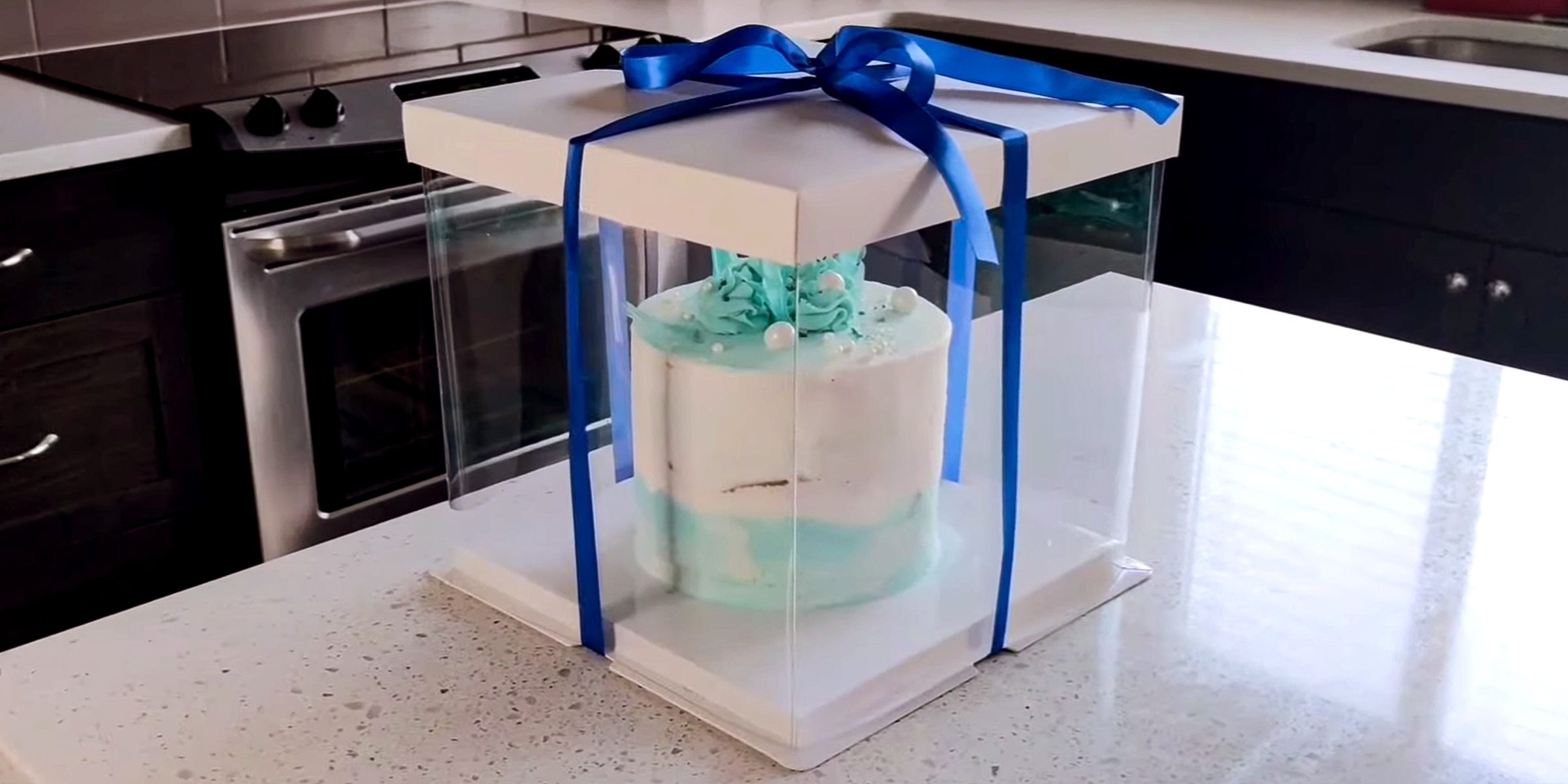 A cake box | Source: YouTube/c-box Packaging
