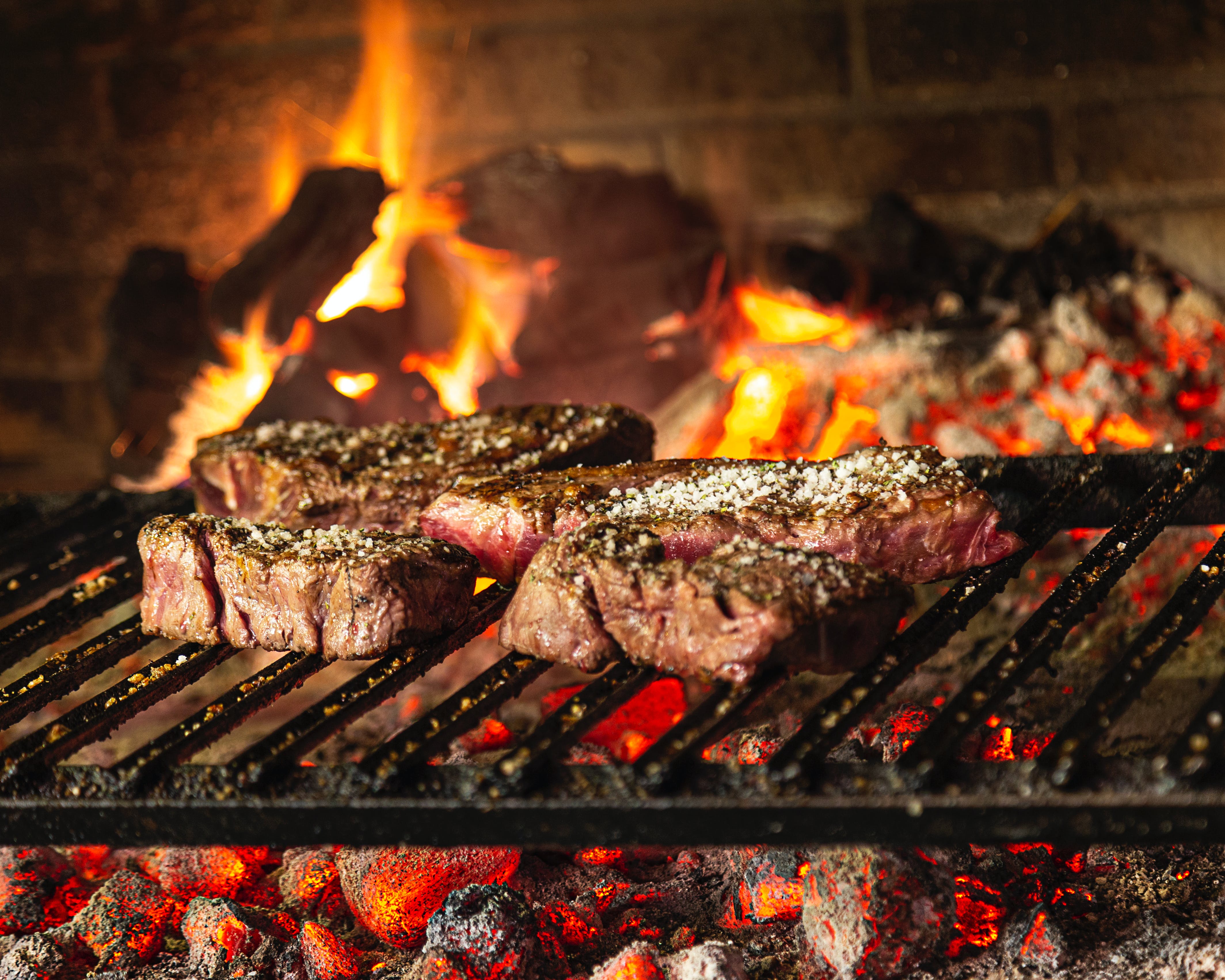 Grilled meat on an Argentine grill | Source: Pexels