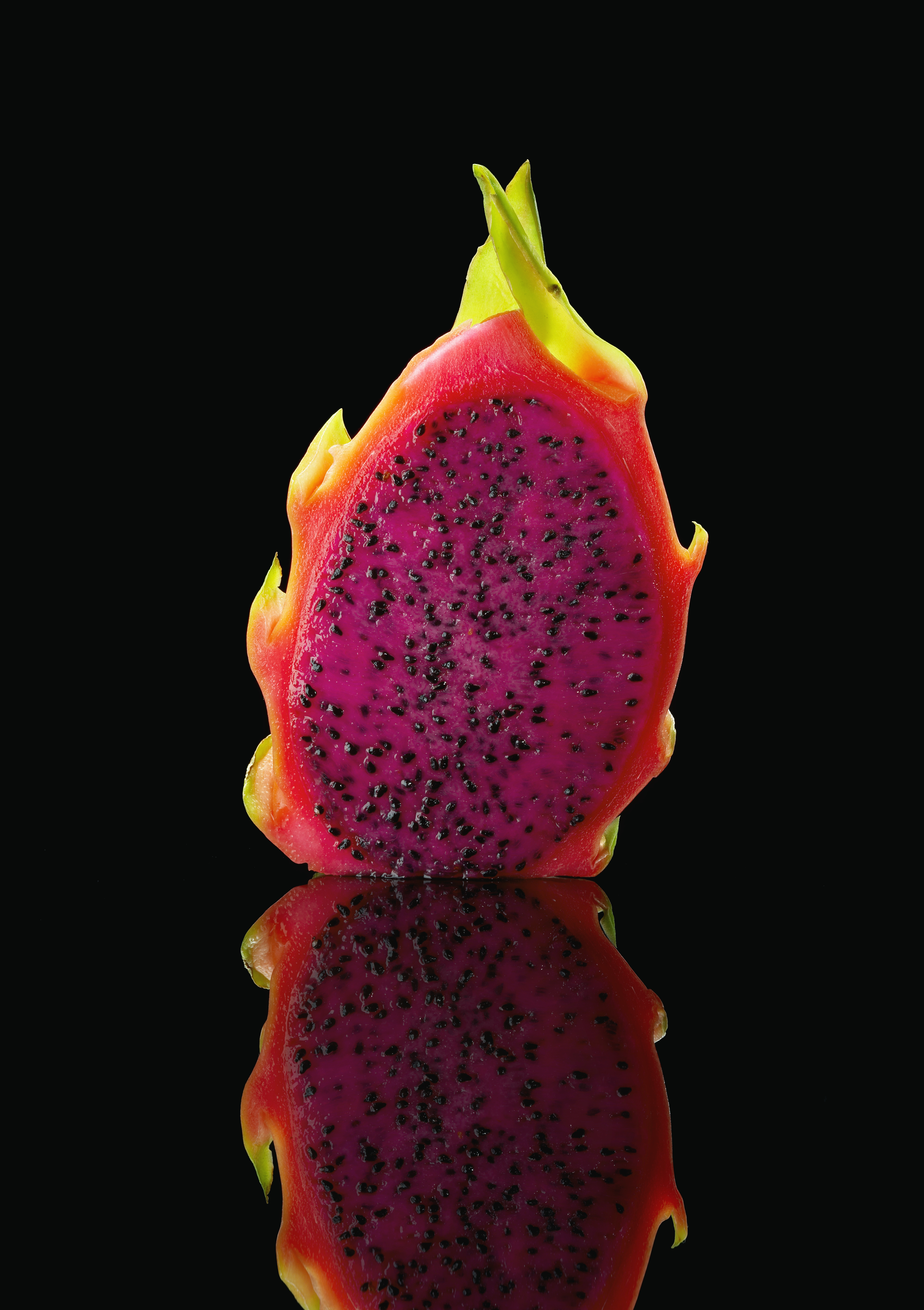 A dragon fruit with red pulp and black seeds | Source: Getty Images