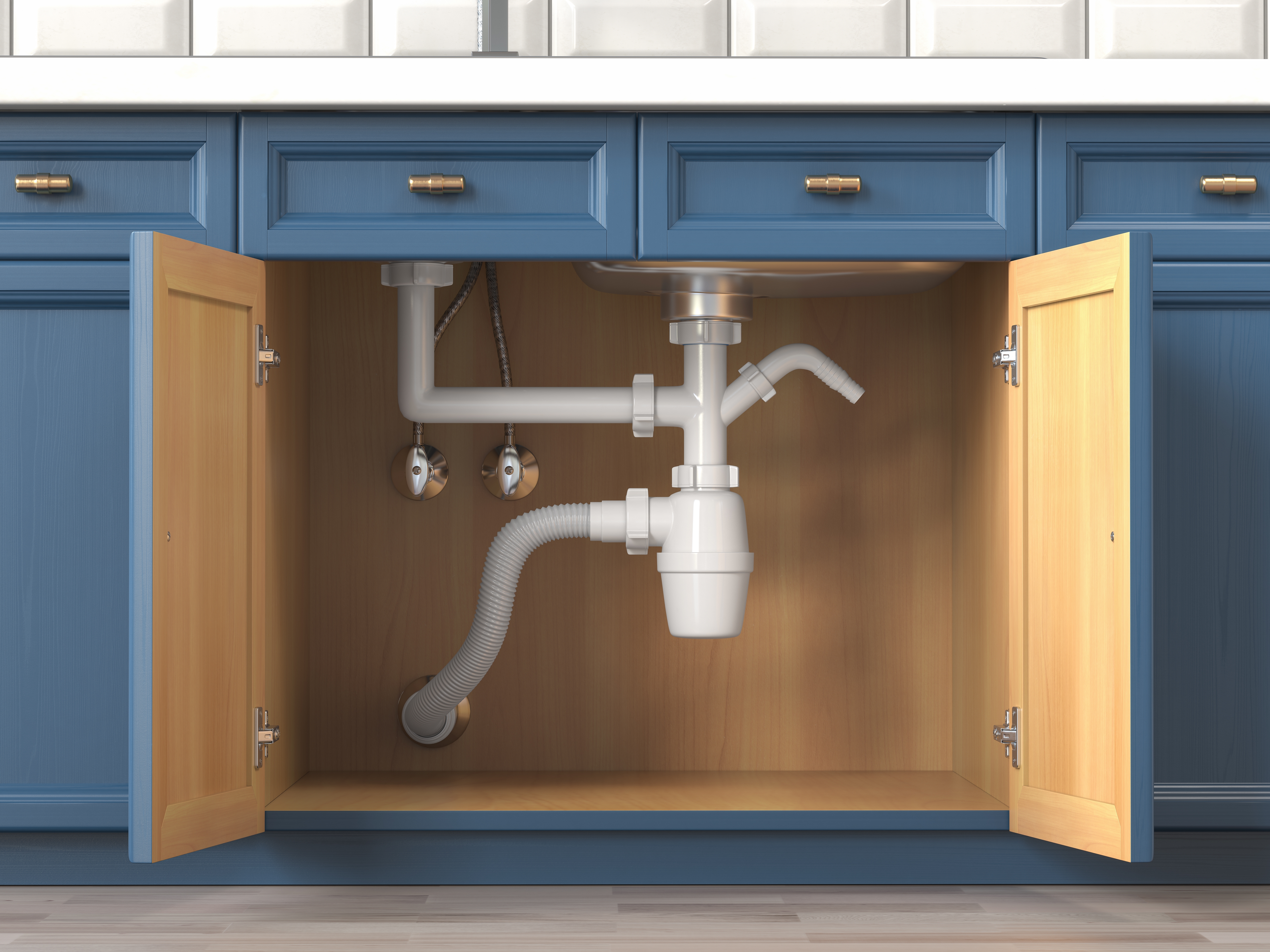 Pipes under a kitchen sink | Source: Shutterstock