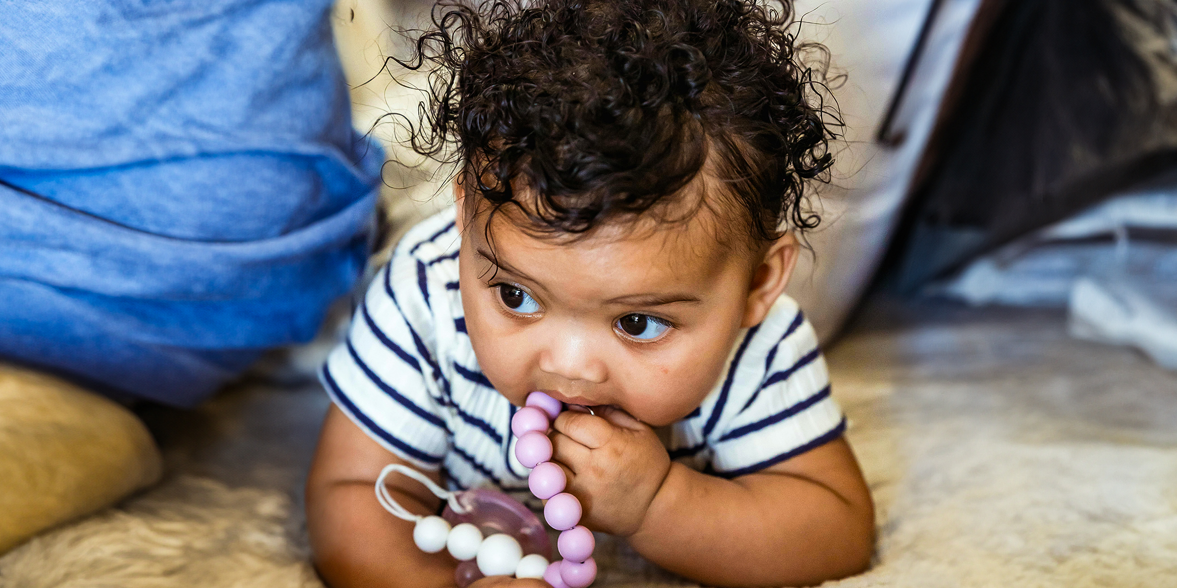 A toddler playing with silicone beads | Source: Pexels/Keira Burton