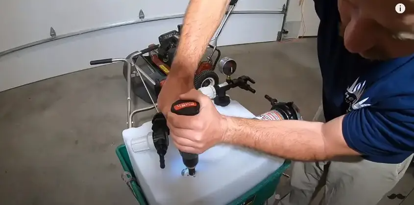 Drill a hole near the pump to install the inline filter. | Source: YouTube/Connor Ward