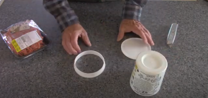 Place the lid and the plastic wrap on the counter. | Source: YouTube/@RoadtrekRich