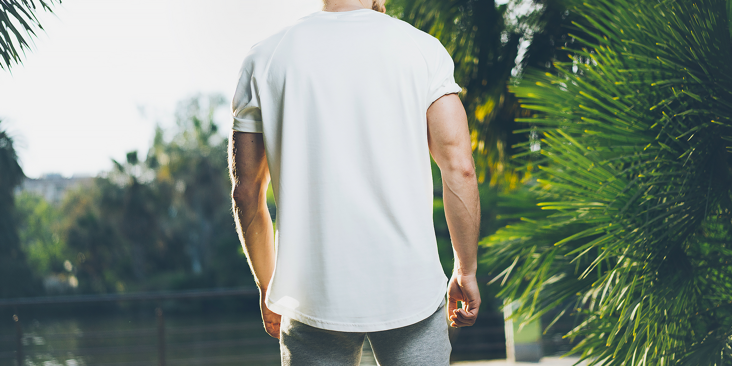 A person wearing a white T-shirt | Source: Shutterstock