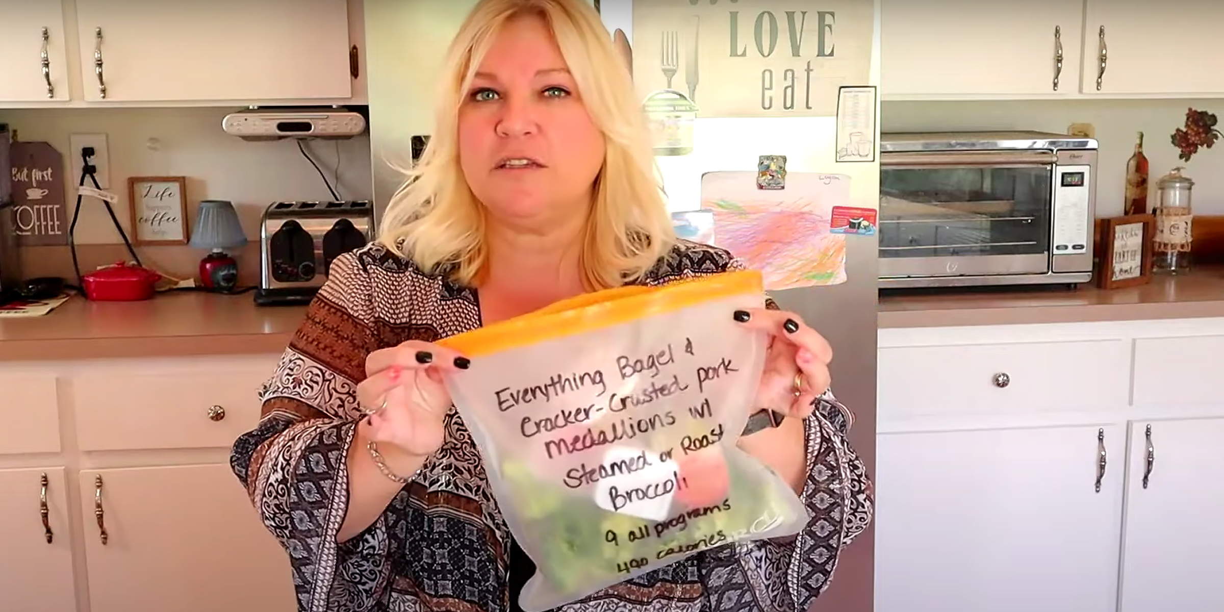 A person holding DIY meal kits | Source: YouTube/@PlanningUsHealthy