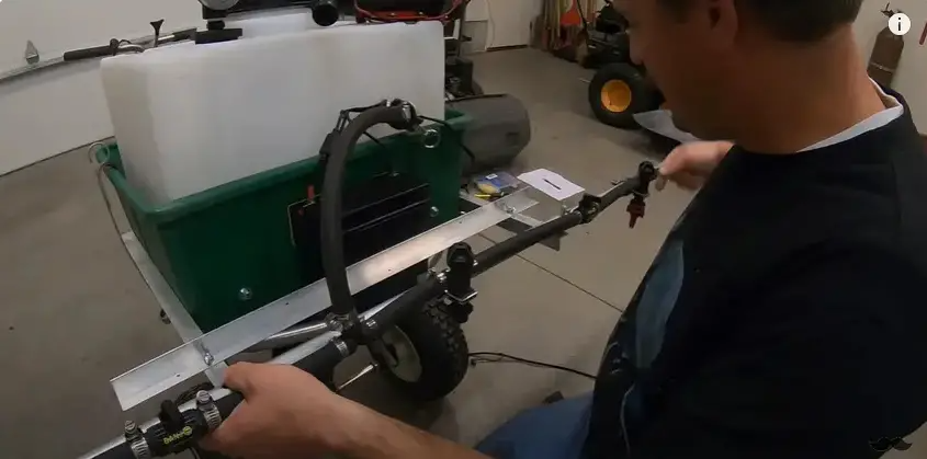 Place the DIY boom sprayer onto a cart. | Source: YouTube/Connor Ward