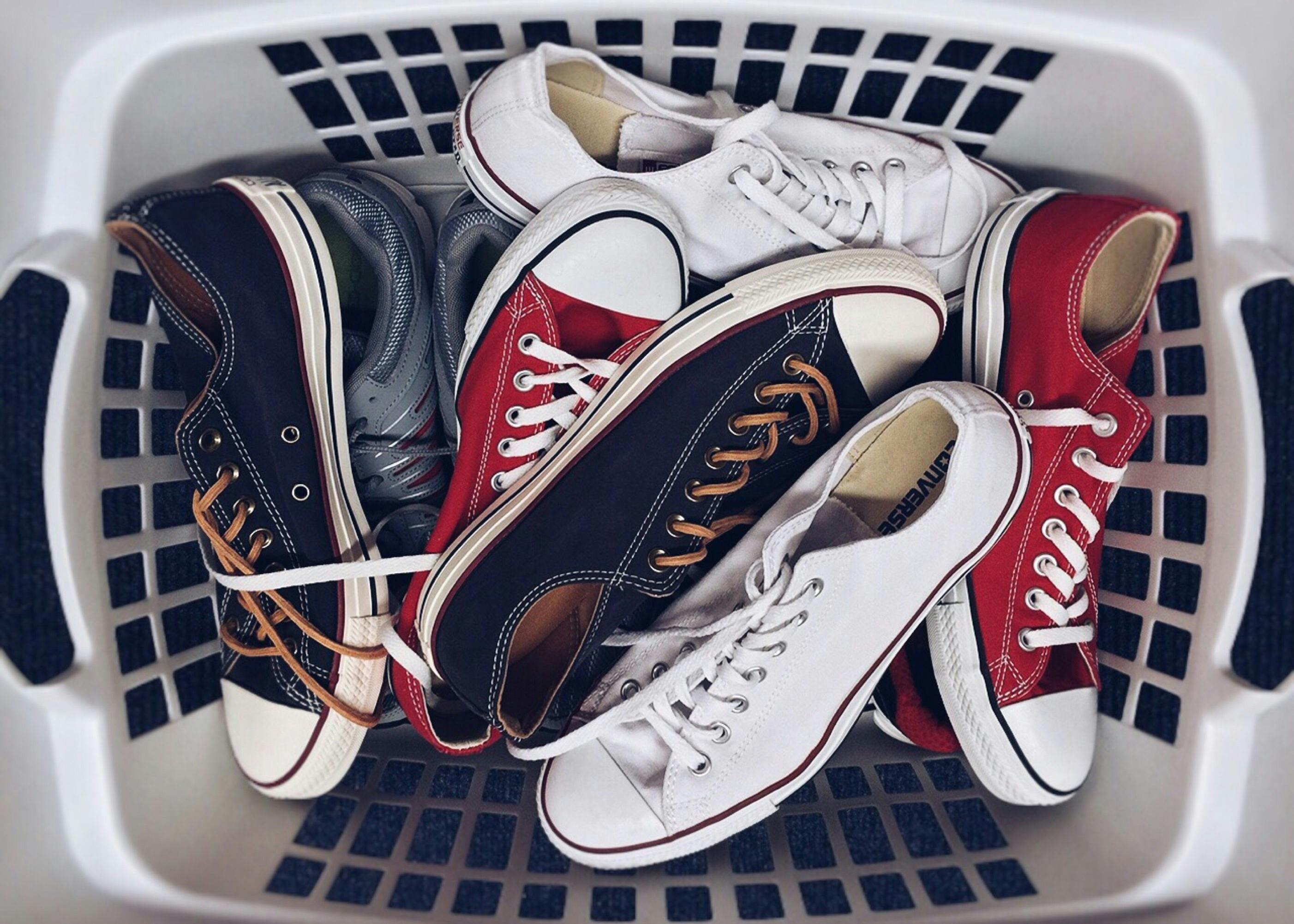 A laundry basket filled with shoes | Source: Pexels