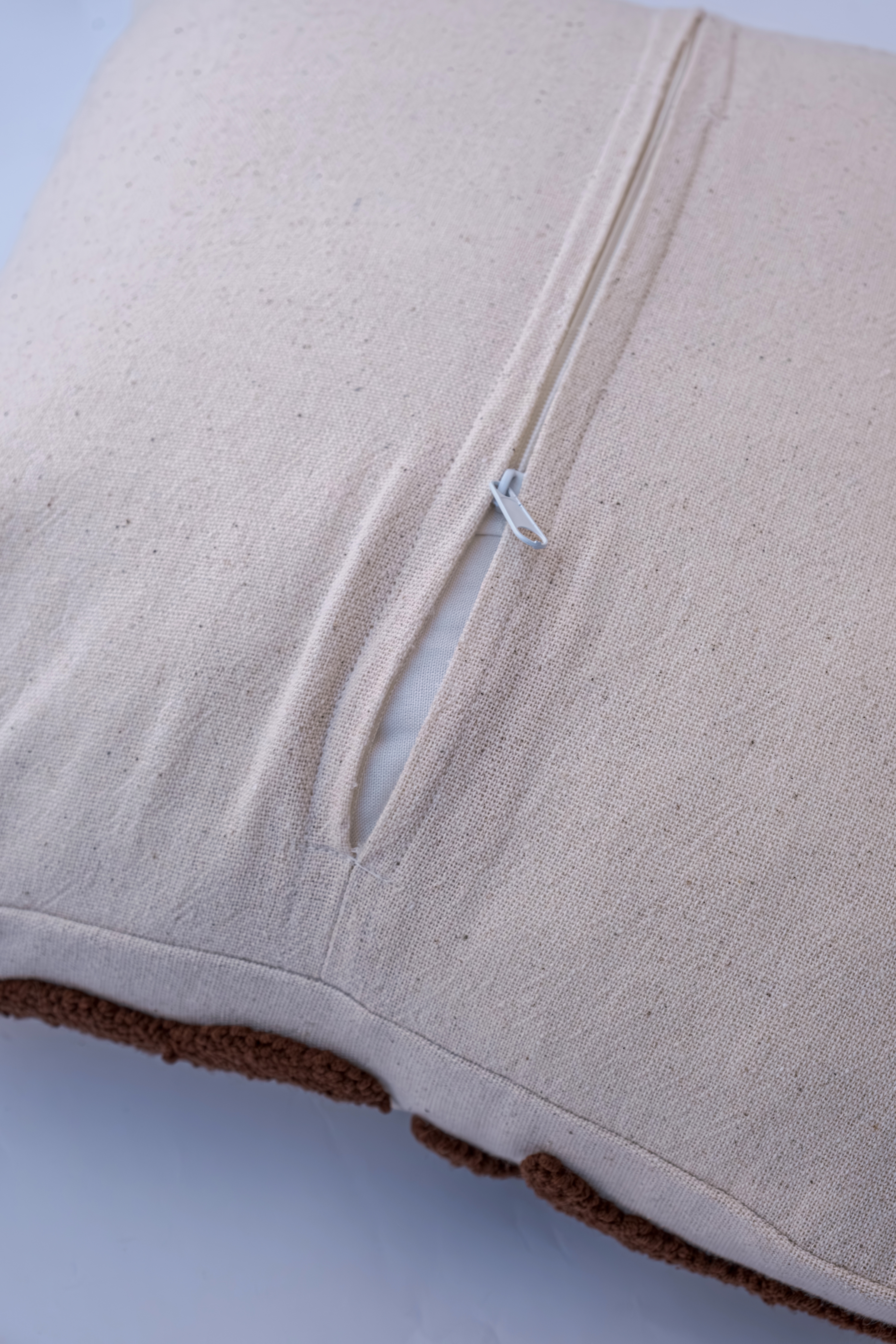 Slightly unzipped couch cushion | Source: Shutterstock