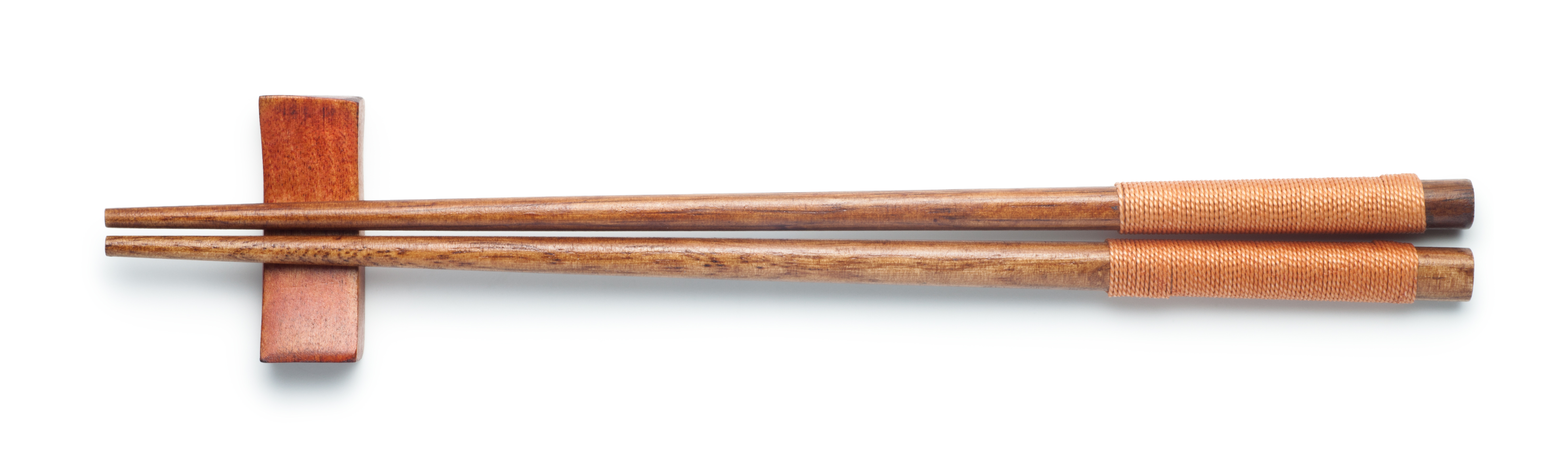 A pair of wooden chopsticks | Source: Shutterstock