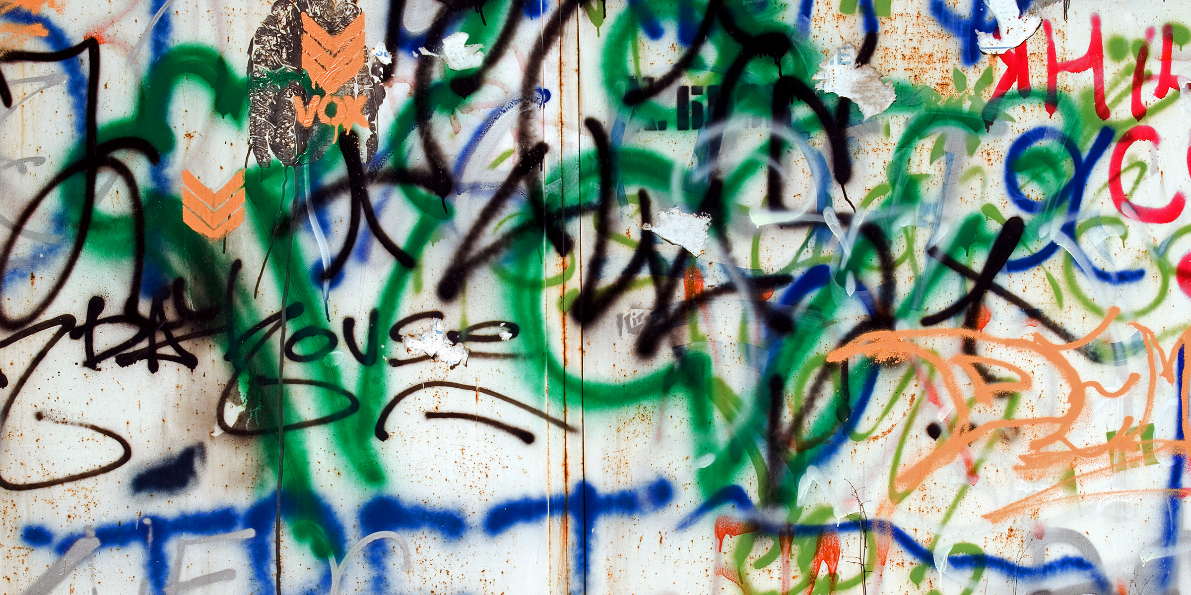 Graffiti on a white wall | Source: Shutterstock